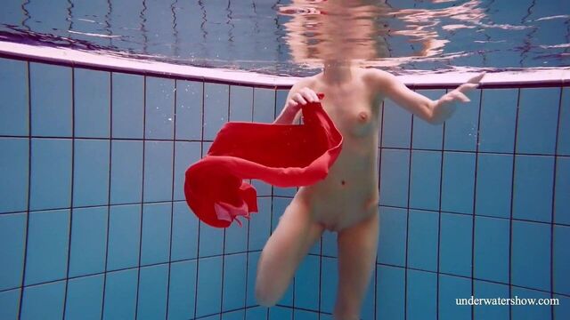 Sexy naked twat Avenna swims nude in the pool