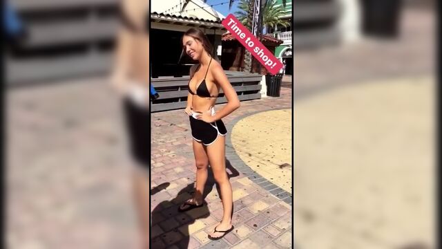 Alexis Ren outdoors in sexy shorts and top