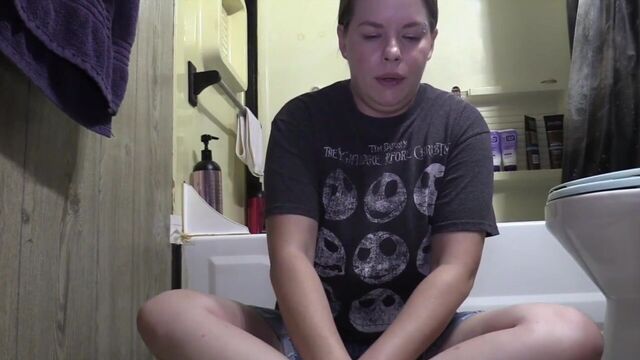 Chubby girl farting on the bathroom floor
