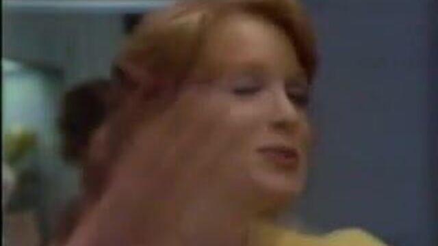 Two broads try on Playtex bras.