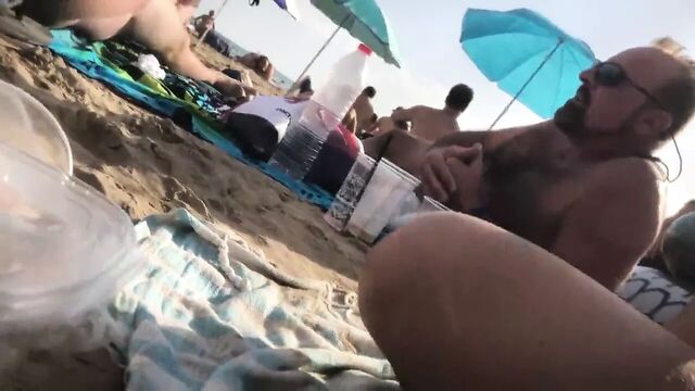 A guy showed his hard cock at beach