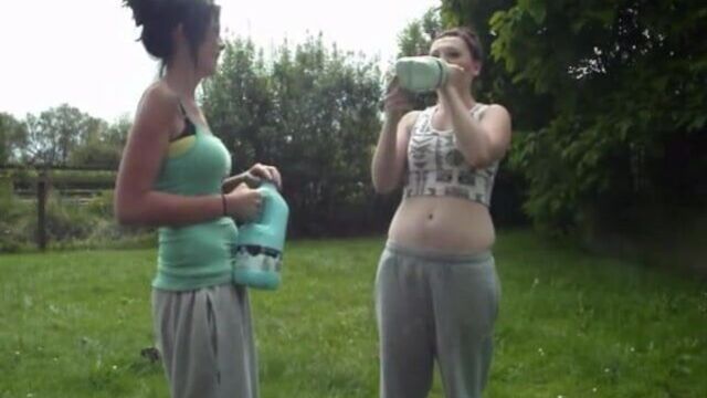 Two hot babes with big belly's do the milk challenge...